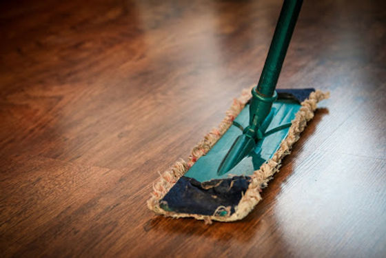 Mop cleaning a wood floor.