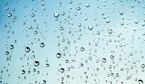 Water droplets on a blue surface.