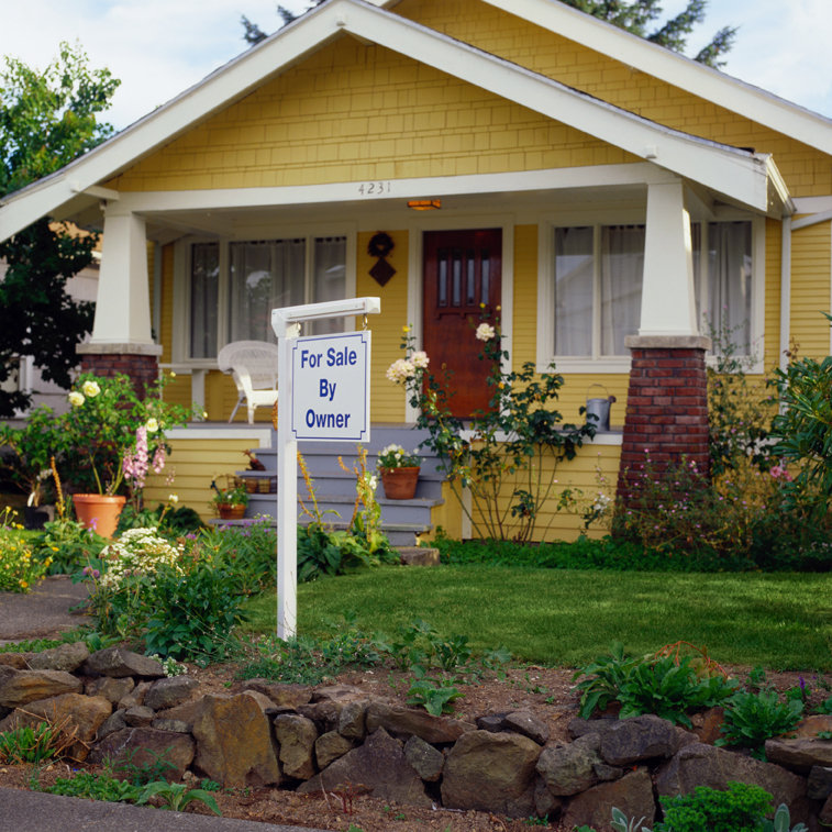 House with a For Sale By Owner sign.