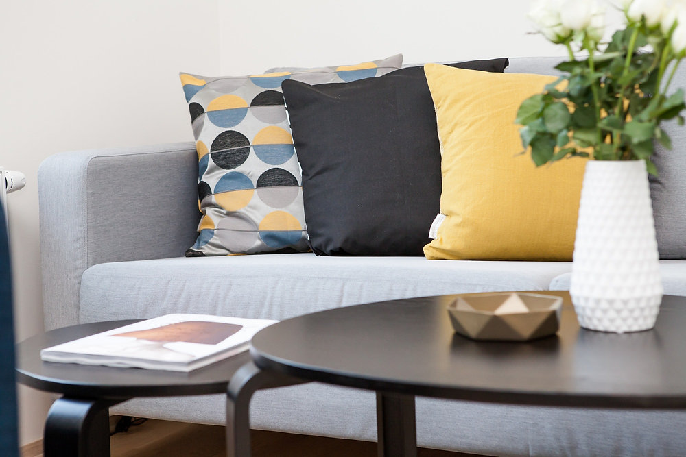 Modern living room with a gray sectional sofa.